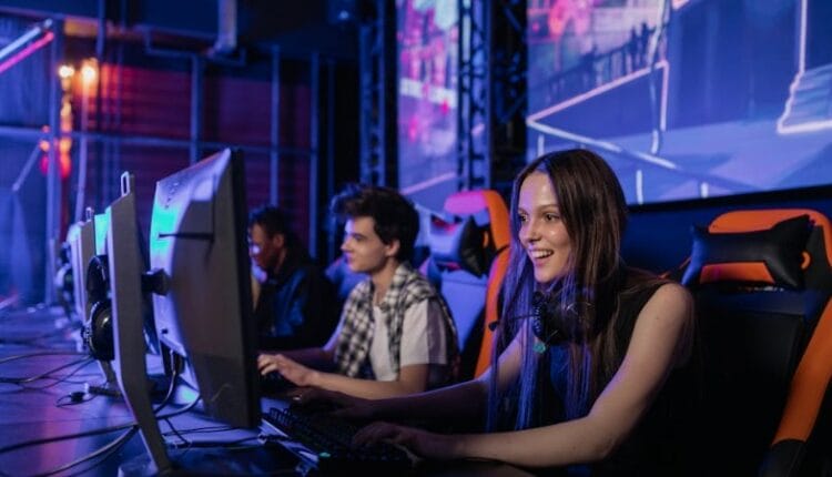 A group of young adults enjoying a gaming session in a vibrant esports arena. - A group of young adults enjoying a gaming session in a vibrant esports arena., tags: e-sport und sportarten - pexel