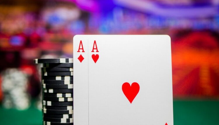 Close-up of poker chips and aces on a green felt casino table, perfect for gambling themes., tags: ein - pexel