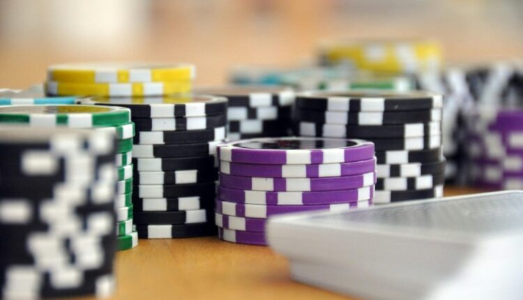 A close-up shot of stacked poker chips and playing cards on a table, perfect for casino and gambling themes., tags: die - pexel
